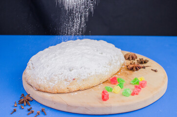 Christmas cake with fruits on a blue background