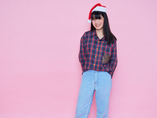 teenage girl wearing santa hat