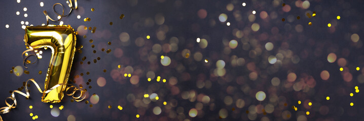 Gold foil balloon number and digit seven 7. Birthday greeting card. Anniversary celebration event....