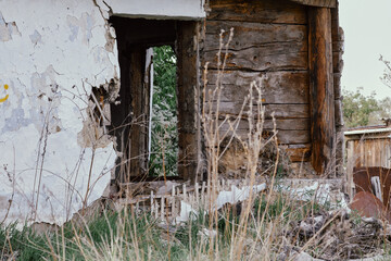 The ruins of an abandoned house in the village. Ruins of an abandoned building in a rural area in Russia.
