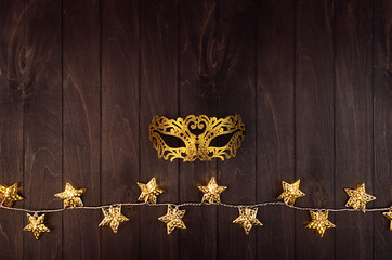 Youth stylish decoration for New Year party -  golden glittering lace ornate theatre mask for...