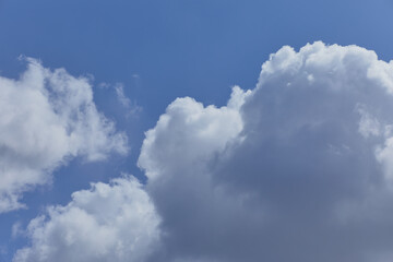 Naklejka na ściany i meble White clouds on a clear blue sky. Gentle white fabulous overlay clouds for Photoshop.