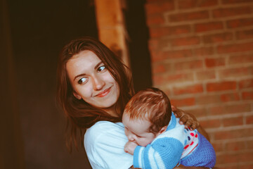 mother holds baby in her arms