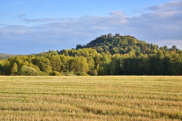 Engelhaus Castle Ruins shown in autumn, colorful trees during the fall season, romantic castle ruins in a forest near Karlovy Vary, Czech Republic.