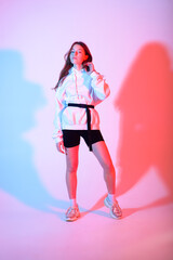 Teenage female dancing hip-hop in studio, casual clothes