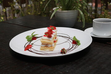 Strawberry Mille Feuille cake in white plate.