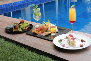 delicious food and drink with pool view