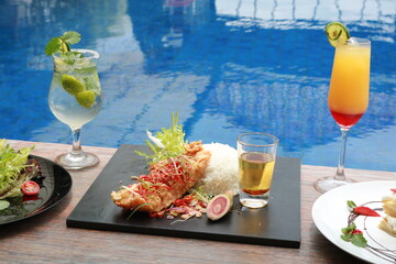 delicious food and drink with pool view