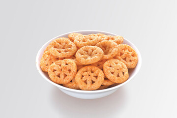 Crispy and crunchy Salty wheat wheel & Wheels, Wheelos, fryums or frymus, Fried and Spicy snack food, Indian Pouch Packing Street Food, selective focus - Image