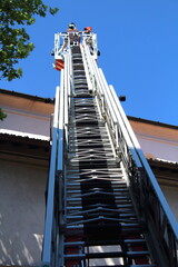 2017.06.18 Milan, Italy, ladder truck in action by the fire brigade during an intervention, detail of the ladder in action