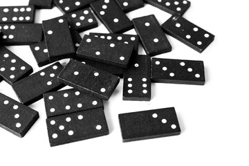 Black dominoes standing on isolated white background