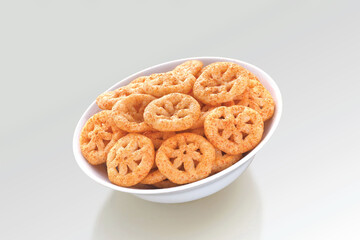 Crispy and crunchy Salty wheat wheel & Wheels, Wheelos, fryums or frymus, Fried and Spicy snack food, Indian Pouch Packing Street Food, selective focus - Image