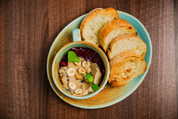 Chicken paste or pate with stewed beetroot and nuts, served with grilled bread