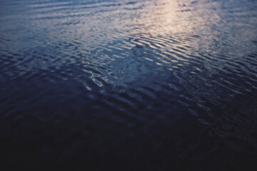 Calm waters in dark blue ocean background