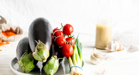 Organic egglants, tomatoes and spring onions