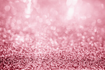 Abstract rose gold glitter sparkle texture with bokeh background