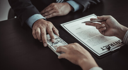 Fototapeta premium Business people take bribes or financial fraud money.