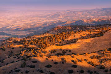 Foothills and hills near the Taurus mountains bathed in the first rays of the summer sun in Turkey