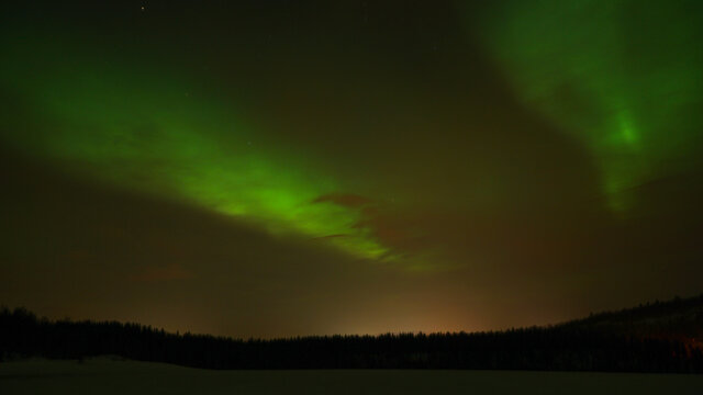 Aurora Borealis Northern Lights seen on a cold winter day in Narvik, Norway.