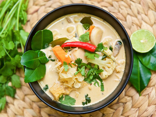 traditional Thai soup tom kha and tom yam with spices in coconut milk, Asian vegetarian and vegan...