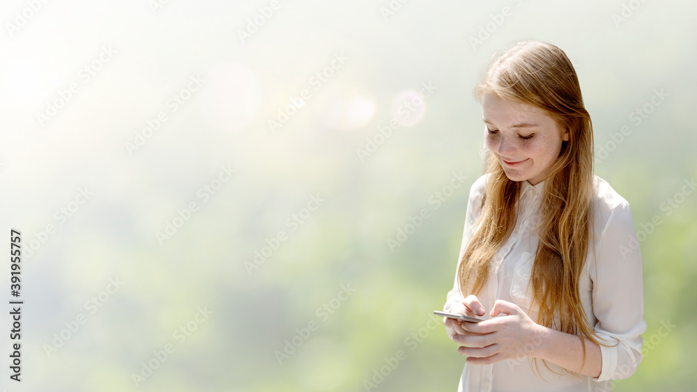 Wall mural girl texting on her phone