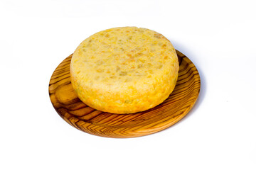 Tasty and big  typical spanish omelette on a wooden tray on white background