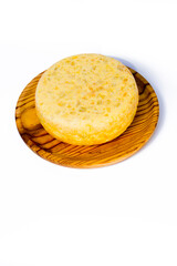 Tasty and big  typical spanish omelette on a wooden tray on white background