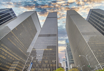 Fototapeta na wymiar New York City at sunset, beautiful sky over city skyscrapers, USA