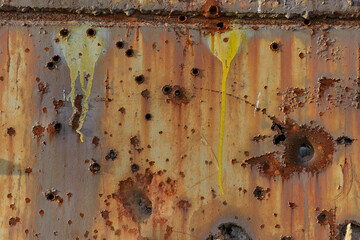 Abstract metal overlay for photoshop with rust, through holes, and splashes of orange paint. Dull red-orange rusty background for games, apps, and social media. Grunge backdrop with vintage wall