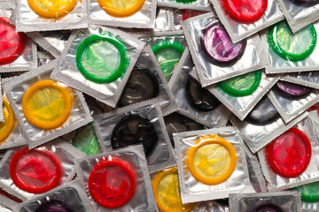 Colorful condoms background.
