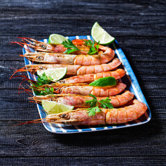 Roasted shrimps served on a plate, close-up
