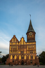 Obraz premium Cathedral Dome in Kaliningrad, Russia at sunset against a blue sky with clouds, vertical view