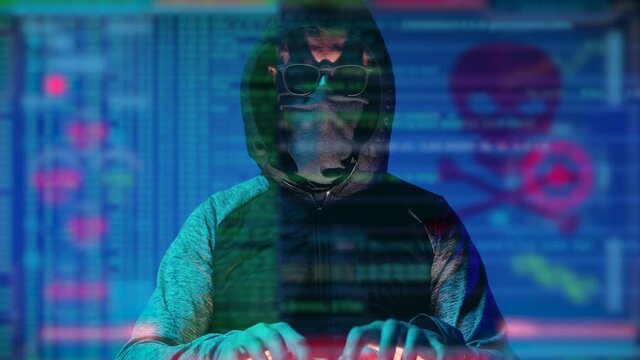 Unrecognizable criminal hacker, sitting in front of the camera, programming bugs and viruses. Software code is overlaying footage. Concept dark internet, cyber security.