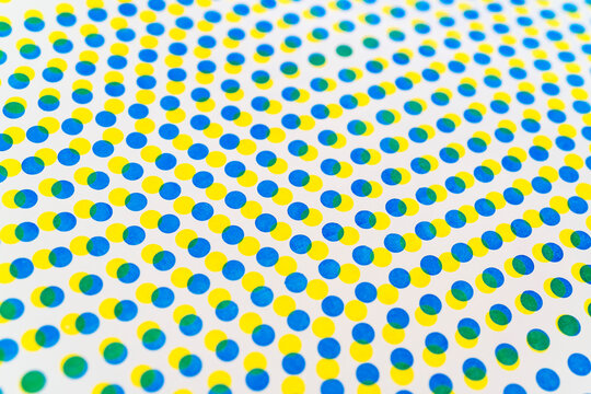 3D blue and yellow dots pattern overlapping on white background
