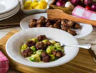 fried meatballs with vegetables and sauce
