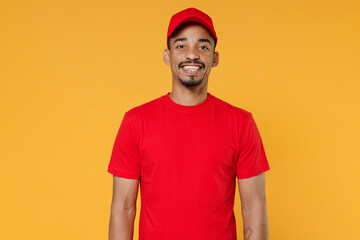 Delivery employee african man 20s in red cap blank print t-shirt uniform workwear work courier...