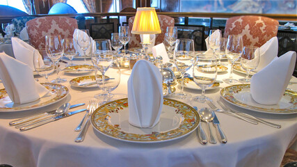 Formal and elegant ocean view dining room restaurant onboard luxury cruiseship or cruise ship liner...