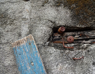 corrosion of a nail embedded in an old wall
