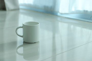 Coffee mug in the morning time with soft light.