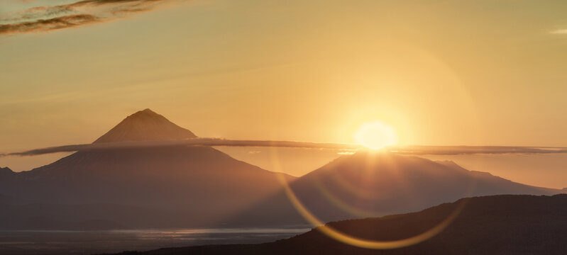 Kamchatka, sunlight over the summit of Avachinsky volcano