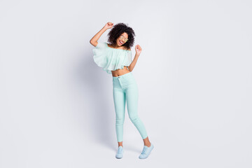 Full length body size photo of dancing girl wearing mint clothes isolated on grey color background