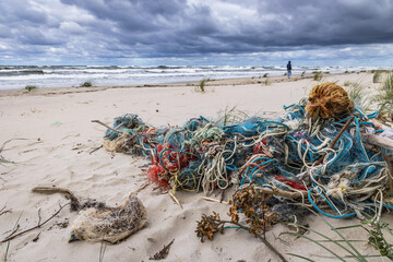 Old fishing nets on Baltic Sea beach on Vistula Spit between Vistula Lagoon and Bay of Gdansk, near...