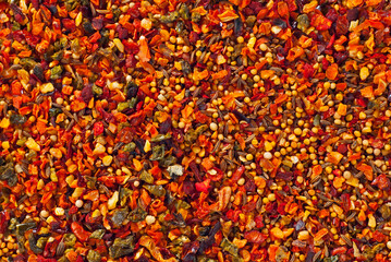 A mixture of different spices close up. Textures of colorful spices and condiments.