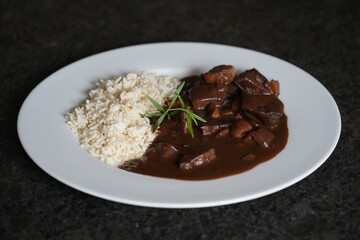 ready to eat - roasted heart and liver from a red deer with rice and sauce