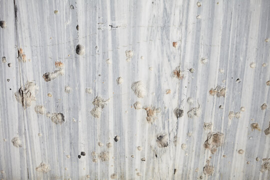 Bullet hole on a marble wall