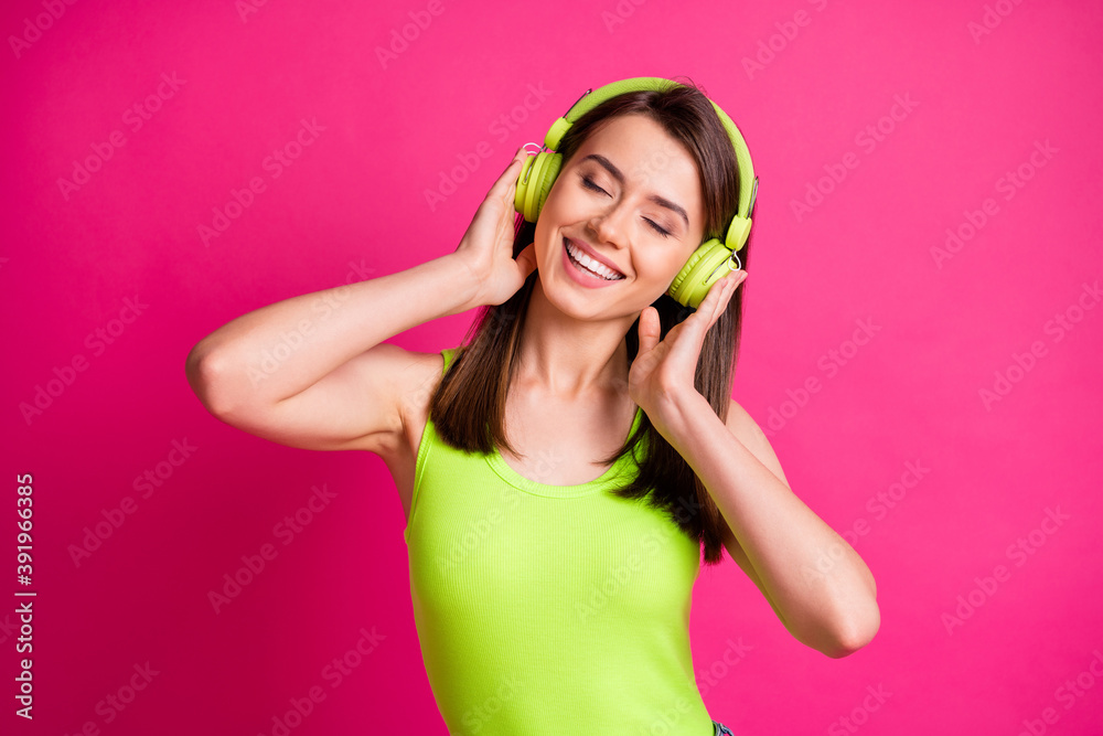 Poster photo of attractive young brown hair girl listen music headphones earphones enjoy smile isolated ove