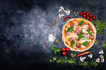 Handmade pizza on dark background