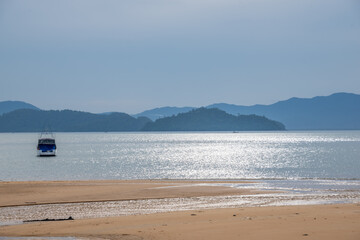 Beautiful view of tropical sea beach over mountains
