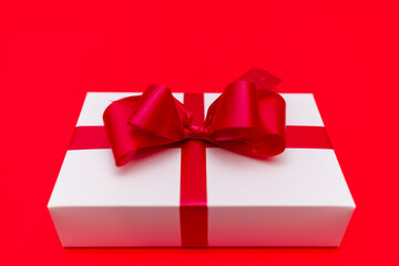 Top view White gift box ribbon flat lay red background.Christmas concept.