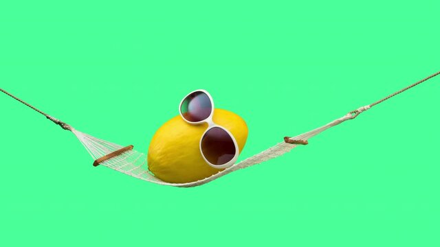Yellow canary melon jumping and relaxing with sunglasses on hammock. Summer vacation and wellness concept. Stop motion animation with alpha matte. 